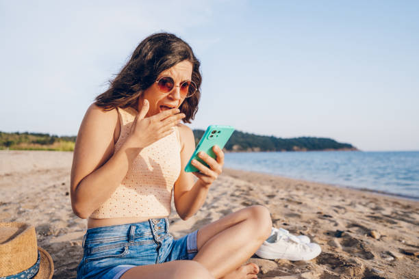 istock A young shocked woman looking at mobile phone 2160747843