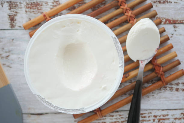 fresh yogurt in a bowl on table .