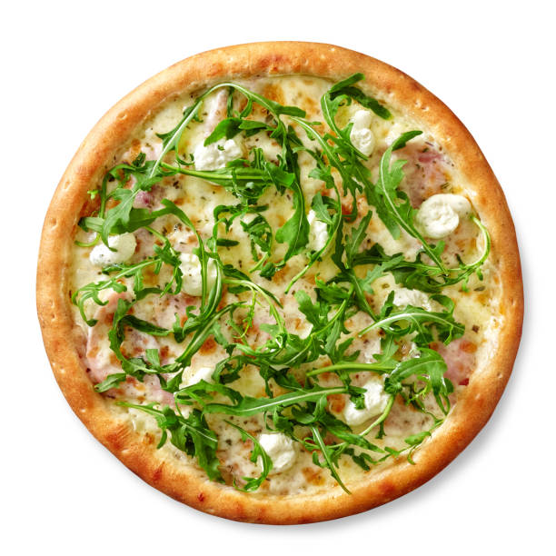 Pizza is topped with fresh salad and dressing.