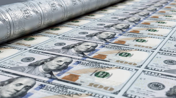 Hundred Dollar Bills Printing on a Machine in a Factory.