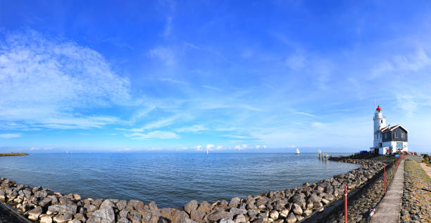 istock Dutch pastoral nature landscape with a small lighthouse on seacoast 2160753319