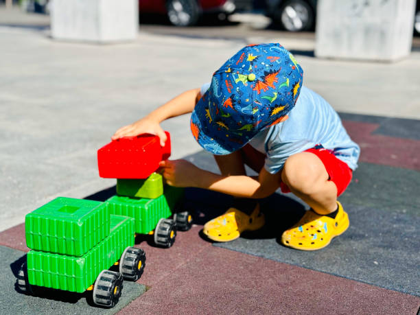 istock Child Building A truck with Blocks Pieces 2160753639