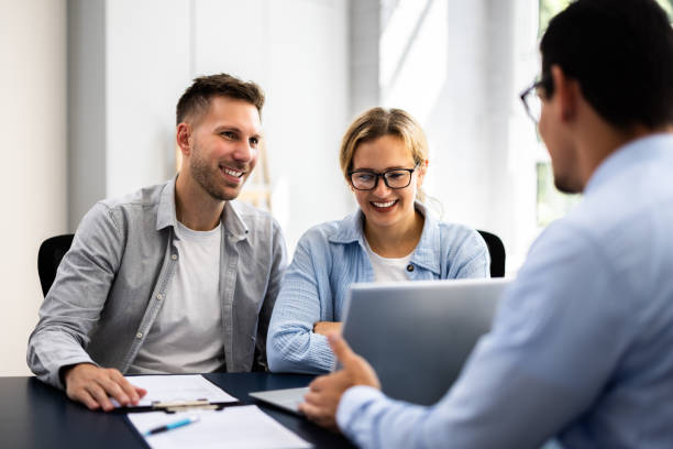 istock young couple is meeting with a financial planner 2160759497
