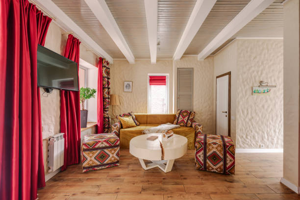 istock A Cozy Living Room with Modern Decor featuring Stylish Red Curtains in a Chic Home 2160759904
