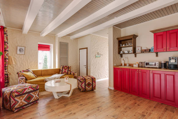 istock Cozy living room with modern rustic style and bright red kitchen for a warm and inviting atmosphere 2160760089