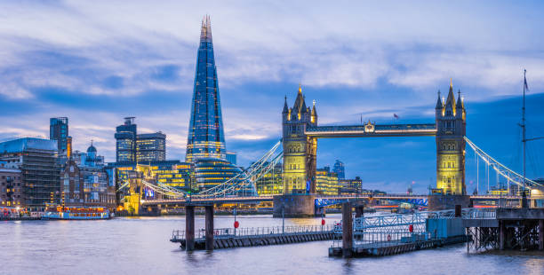 istock London Shard Tower Bridge River Thames illuminated at dusk panorama 2160761234