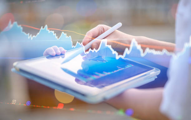 istock Businesswomen using AI investment Performance Tracking financial predictions, featuring invesying charts and graphs for market analysis 2160761272