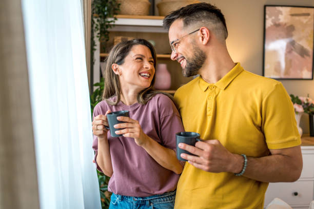 istock Young couple drinking coffee together 2160761497