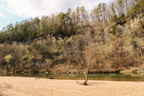 A wide shot of bluffs seen on the Jacks Fork River in the Ozark National Scenic Riverways. Southern Missourri.