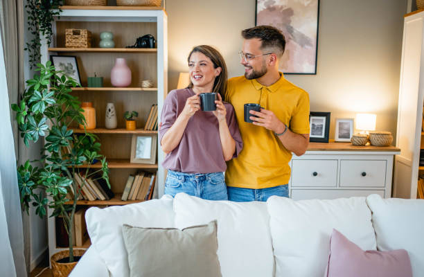 istock Young couple drinking coffee together 2160761658