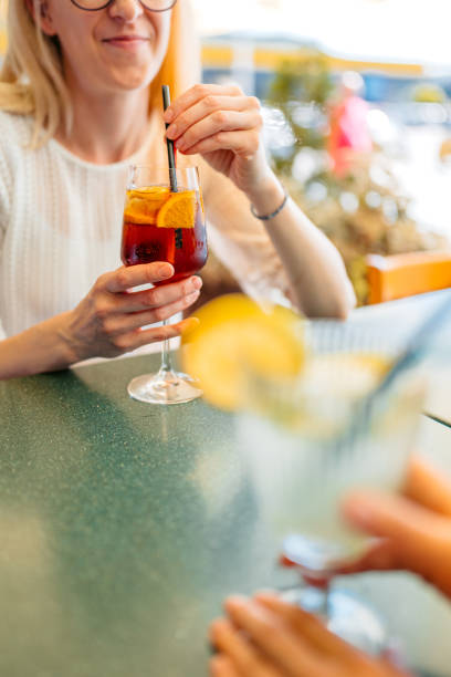 istock Young Woman Drinking Amaro Spritz Cocktail In A Bar 2160767017