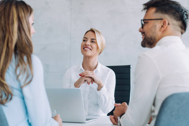 istock Group of business persons talking in the office. 2160767845