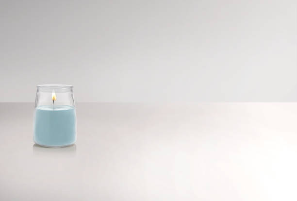 Scented candle in a jar on a white background