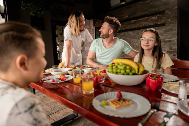 istock Family enjoying breakfast on a patio 2160773637