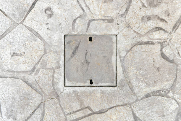 istock Stamped concrete and drain cover. 2160775267