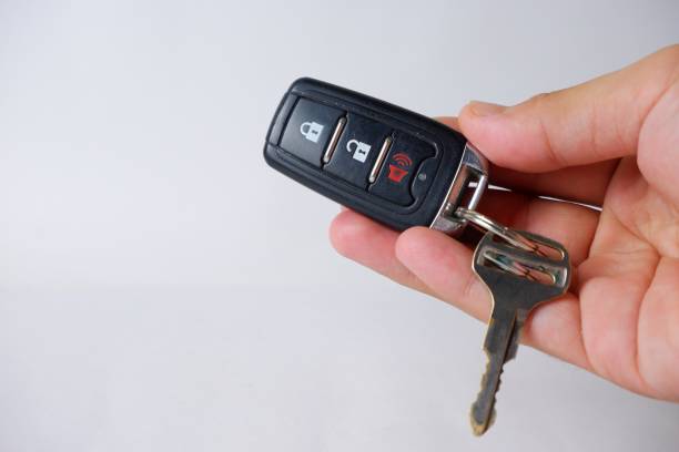 istock Alarm remote and car keys on an isolated white background 2160778167