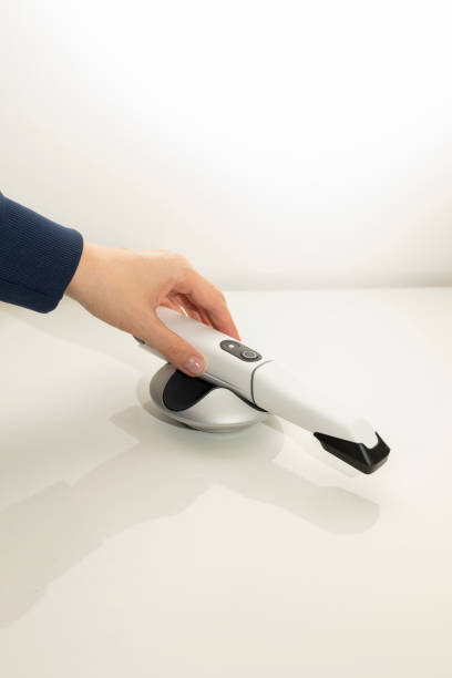 istock Doctor's Hand Holds 3D Intraoral Teeth Scanner For Imaging Tooth. Vertical Plane. Lab, Dental Equipment, Device, Dentistry. Copy Space 2160781752