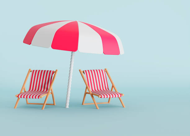 istock Two beach chairs and sun umbrella on isolated blue background with space for copy 2160782282