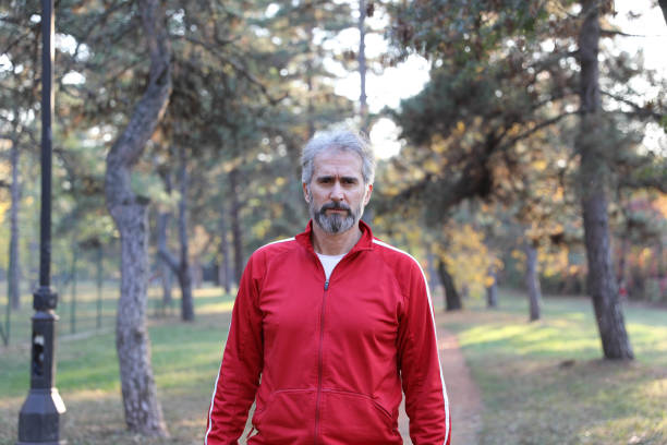 Senior Man is Doing Sport Outdoors. City Park