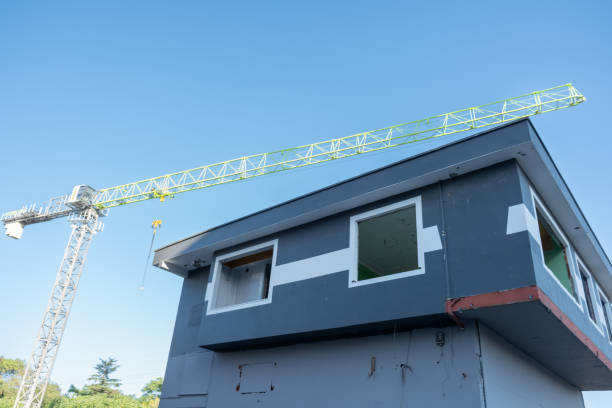 istock High building construction crane. Construction crane with blue sky background 2160783036