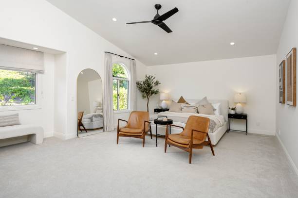 istock Modern and spacious bedroom with minimalist decor. 2160784375