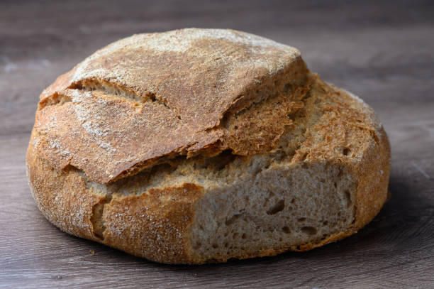 istock whole grain freshly baked bread on the table 2 2160785735