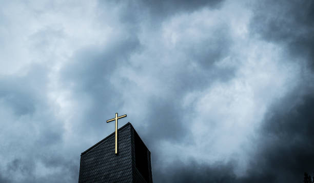 dark clouds above the catholic church