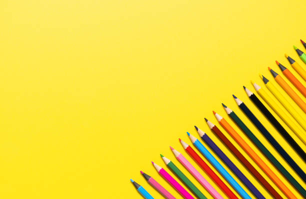istock Set of multi-colored pencils on a yellow background 2160787786