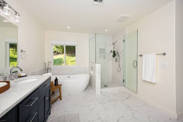 istock Modern bathroom with marble flooring, a freestanding bathtub. 2160788579