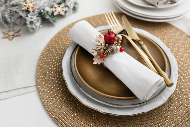 istock Luxury gold Christmas place setting arrangement on table 2160792252