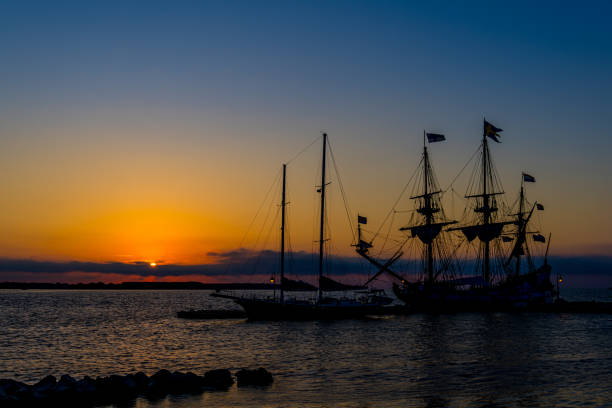 Sailboats docked at sunrise