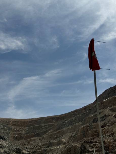 istock Ore trucks in an open-pit mine, Open pit mine, Heavy machinery in mine 2160798055