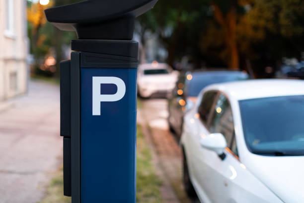 istock Blue automatic parking ticket machine on city street with blurred cars. Modern technologies concept 2160799062