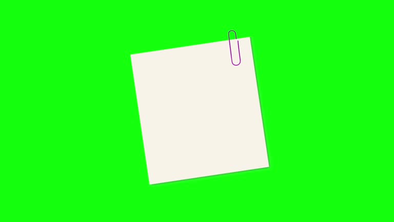 Sticky notes paper with paperclip on green screen background. Sticky note with empty space