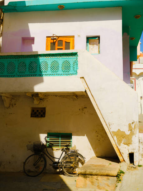 Colourful building in Udaipur with bicycle  under the porch. India, Rajasthan