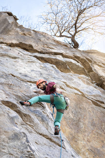istock Young man climbing a challenging route on a cliff. Extreme sport. 2160808218