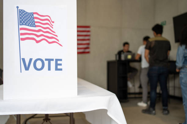 istock diverse group of people waiting in queue registration line in the us election ready for voting 2160817830