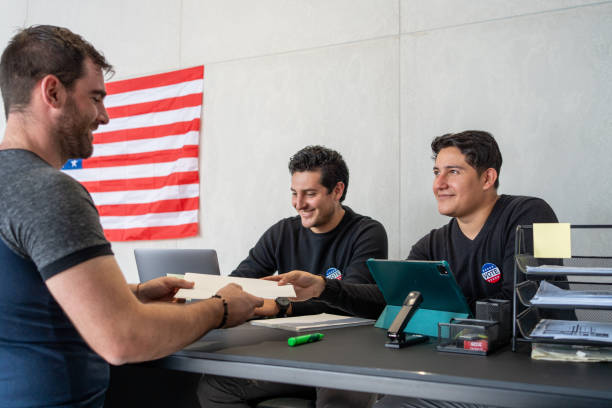 istock young caucasian man register for voting in election day 2160818290