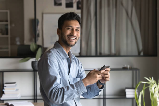 istock Cheerful successful Indian business professional man using financial application 2160823609