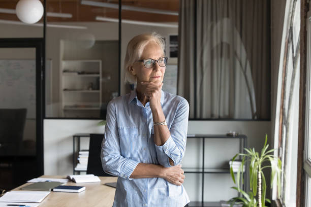 istock Serious thoughtful senior business owner woman thinking on solutions 2160823655
