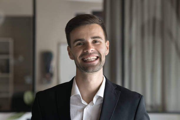 istock Cheerful handsome business man in formal jacket looking at camera 2160824361