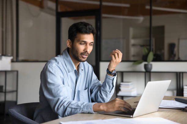 istock Serious Indian project manager man talking to client 2160828171