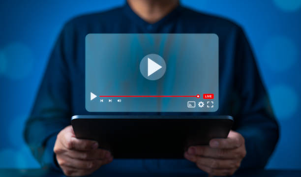 istock E-learning or Online streaming. People watch live content on tablet with seamless internet connection. Live playing broadcast video content via online technology. Relax or Self-knowledge acquisition. 2160830107