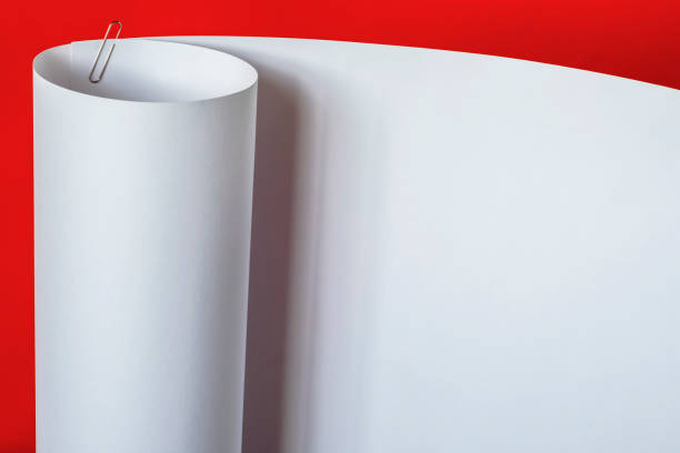 A large sheet of A1 paper on an orange background.