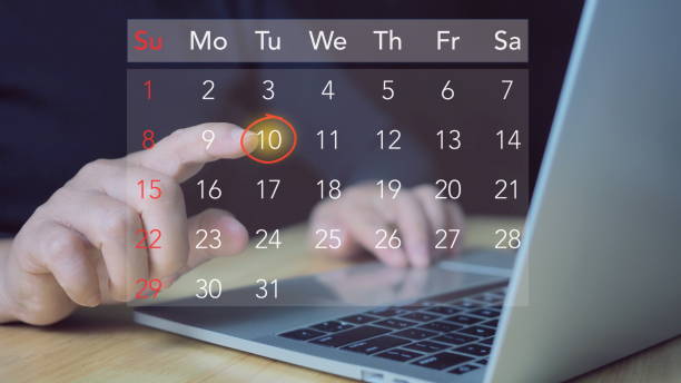 istock Businessman manages time for effective work. Calendar on the virtual screen interface. Highlight appointment reminders and meeting agenda on the calendar. Time management concept. 2160831032
