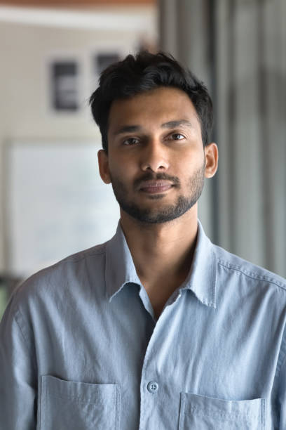 istock Serious attractive Indian man posing for vertical head shot 2160831106