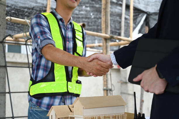 istock Construction manager shaking hands with investor at building site. Partnership and successful project 2160832821