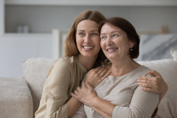 istock Loving tender daughter hugging her attractive pensive older mother 2160835565