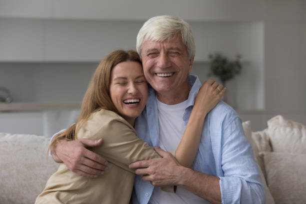 istock Young woman cuddling her hoary old daddy 2160836103