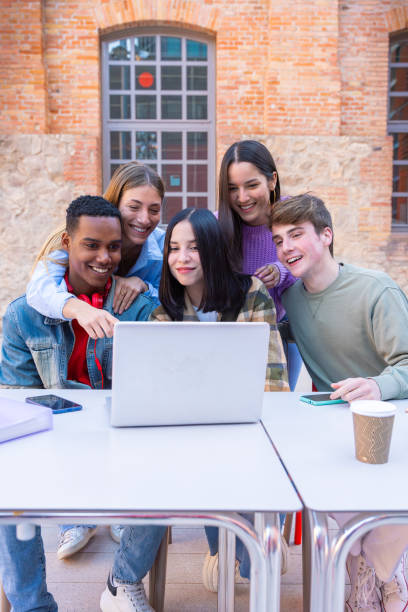 istock Group of students, prepare for university exams, use a laptop.Vertical 2160836703